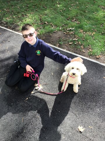 Image of Our Achiever of the week took Daisy for a walk with Mrs Miles